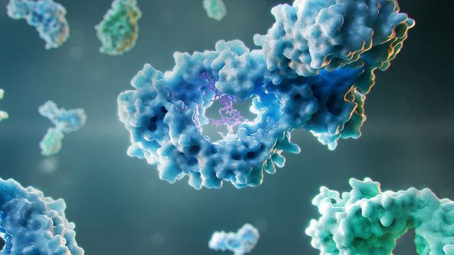 The image shows multiple colorful, large, complex molecular structures floating in a space with a gradient background. 